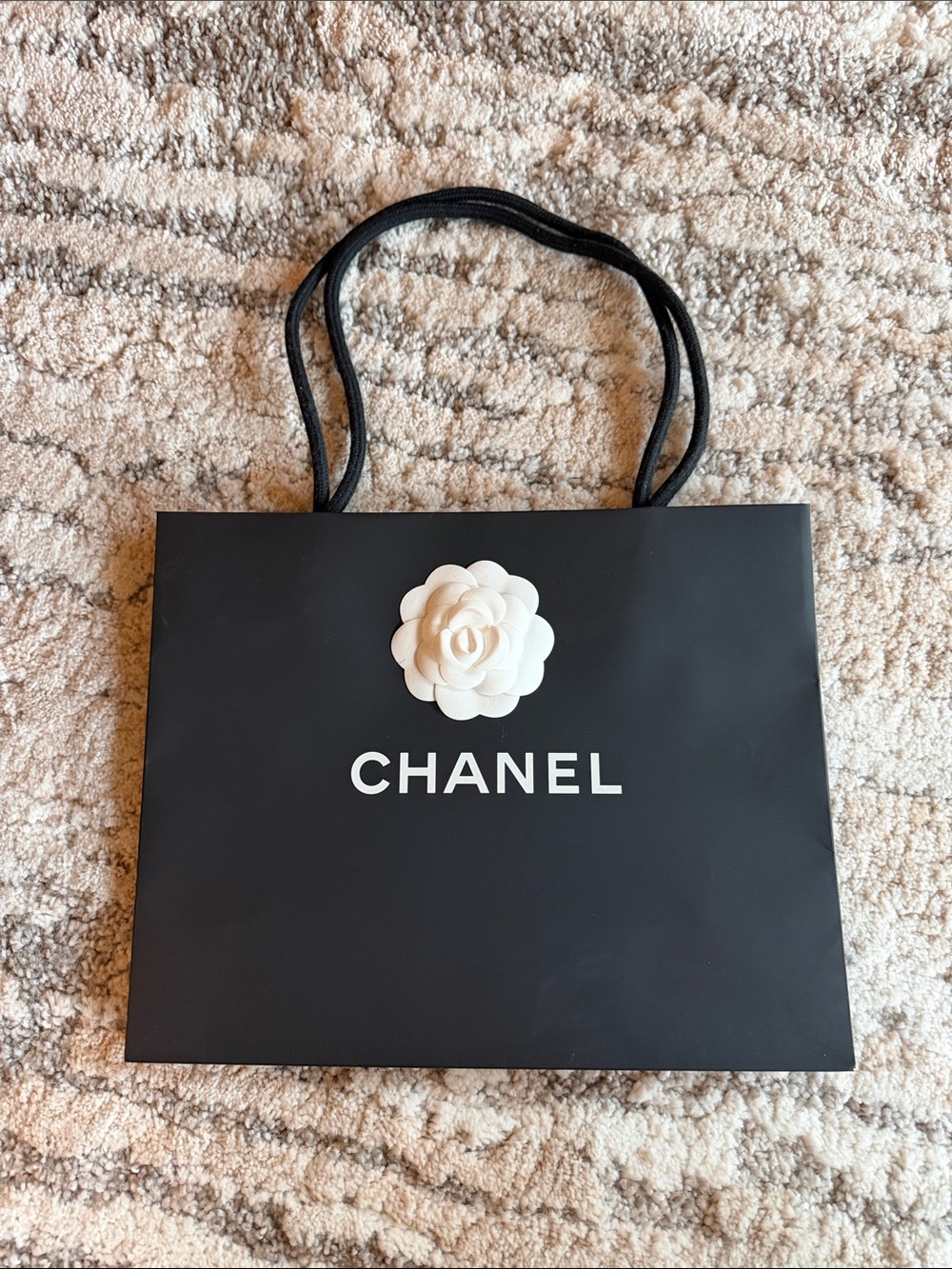 CHANEL Black Shopping Bag with White Camellia Accent